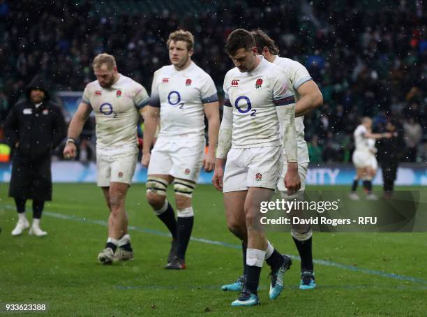 Jonny May of England walks off the pitch with team mates after their defeat during the NatWest Six Nations match between England and Ireland at...