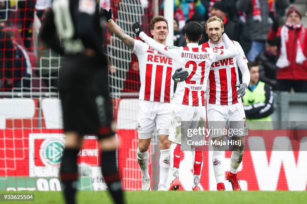 Simon Zoller of 1.FC Koeln celebrates with Leonardo Bittencourt of 1.FC Koeln and Marcel Risse of 1.FC Koeln after scoring his teams second goal...