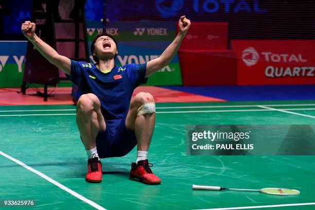 China's Shi Yuqi celebrates beating China's Lin Dan in the men's singles final match at the All England Open Badminton Championships in Birmingham,...