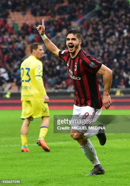 Milan's Portuguese forward Andre Silva celebrates after scoring during the Italian Serie A football match AC Milan vs AC Chievo at the San Siro...