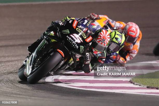 Monster Yamaha Tech 3's French rider Johann Zarco leads the pack during the 2018 Qatar Moto GP Grand Prix at the Losail International Circuit in...