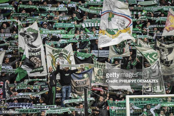 Saint-Etienne's fans wave during the French L1 football match between AS Saint-Etienne and EA Guingamp, on March 18 at the Geoffroy Guichard stadium...