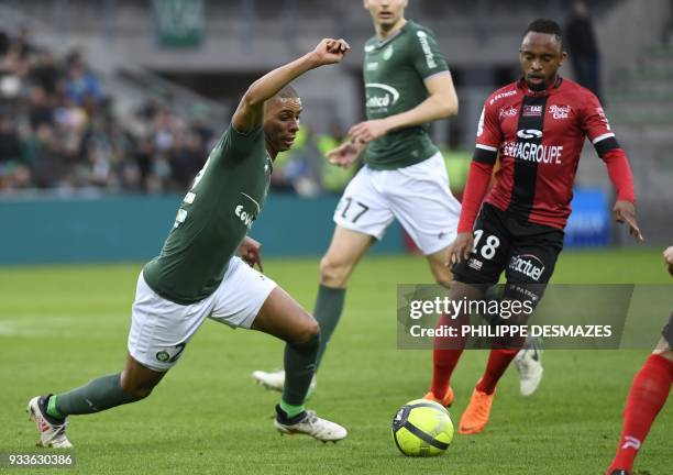 Saint-Etienne's French forward Kevin Monnet-Paquet vies with Guingamp's South african midfielder Lebogang Phiri during the French L1 football match...