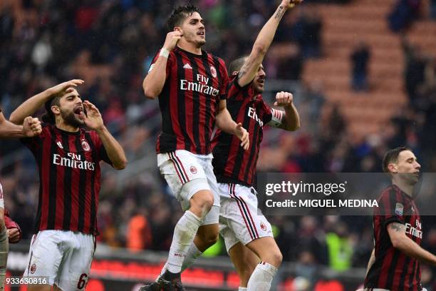 Milan's Portuguese forward Andre Silva celebrates with teammates at the end of the Italian Serie A football match AC Milan vs AC Chievo at the San...