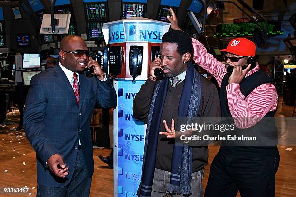 Group Boyz II Men' Wanya Morris, Shawn Stockman and Nathan Morris tour the trading floor at the New York Stock Exchange on November 24, 2009 in New...