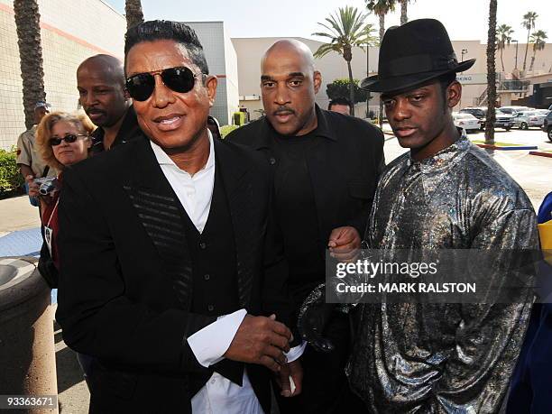 Jermaine Jackson meets a lookalike of his deceased brother Michael, as he arrives for a special screening for students of local schools for the...