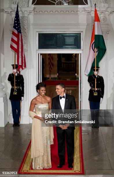 First lady Michelle Obama and President Barack Obama await the arrival of the Indian Prime Minister at the North Portico of the White House November...