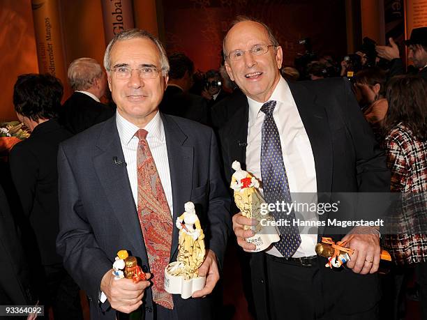 Nicholas Stern and Alex S. MacLean pose with their awards during the annual Corine awards at the Prinzregenten Theatre on November 24, 2009 in...