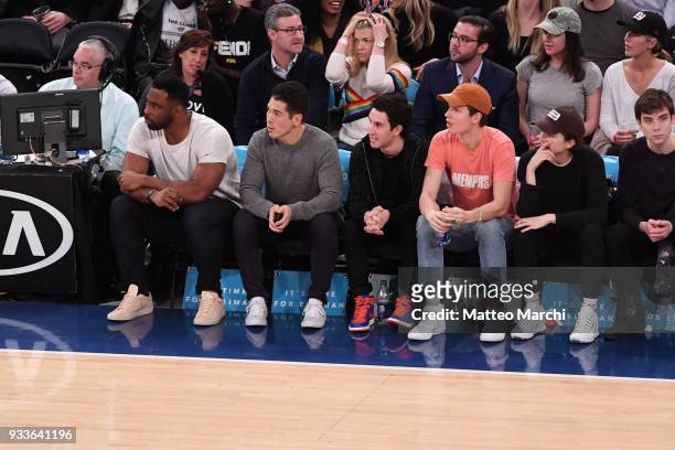 Actors Ansel Engort, Timothee Chalamet and New York Giants legend Justin Tuck attend the game between the Philadelphia 76ers and the New York Knicks...