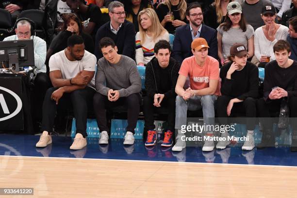 Actors Ansel Engort, Timothee Chalamet and New York Giants legend Justin Tuck attend the game between the Philadelphia 76ers and the New York Knicks...