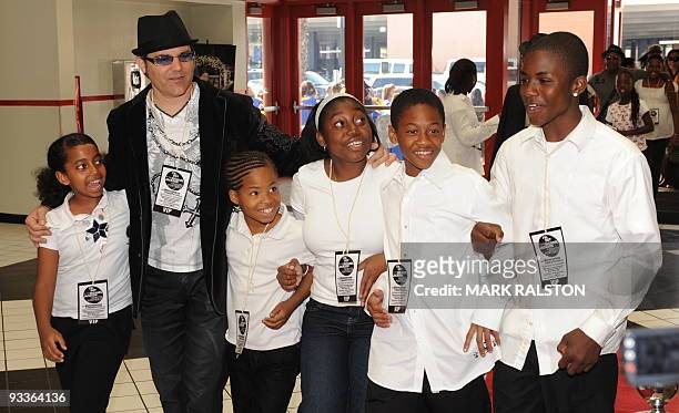 Local school children arrive for a special screening of the film "This Is It" in Los Angeles on November 24, 2009. Michael Jackson's posthumous movie...