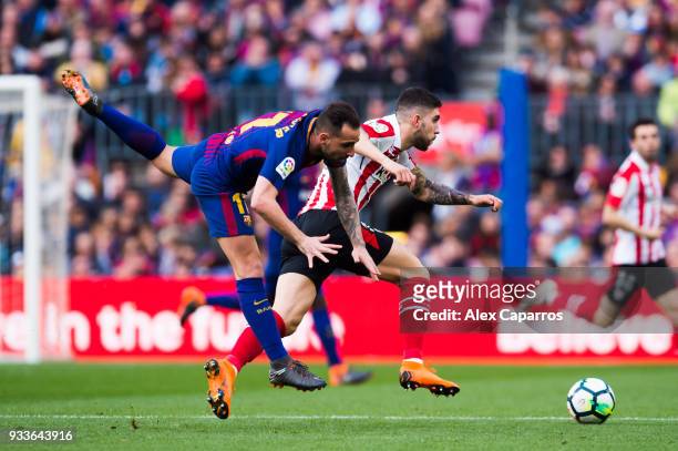 Paco Alcacer of FC Barcelona fights for the ball with Unai Nunez of Athletic Club during the La Liga match between Barcelona and Athletic Club at...