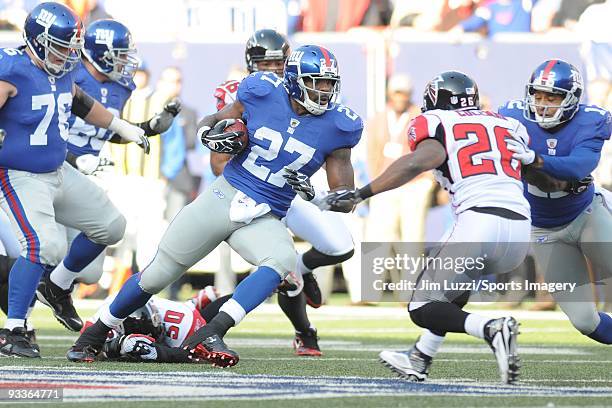 Brandon Jacobs of the New York Giants carries the ball against the Atlanta Falcons during a NFL game on November 22, 2009 at Giants Stadium in East...