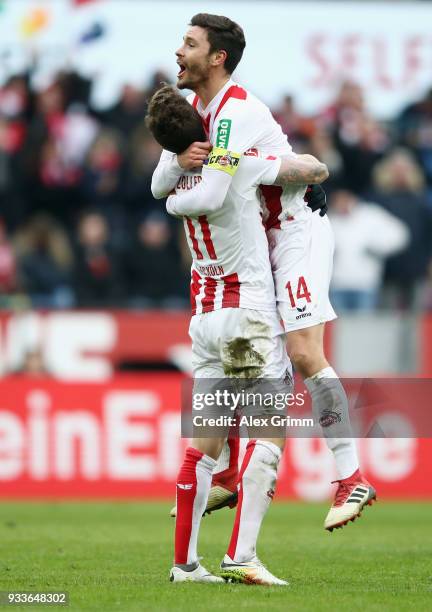 Simon Zoller of Koeln celebrates his team's second goal with team mate Jonas Hector during the Bundesliga match between 1. FC Koeln and Bayer 04...