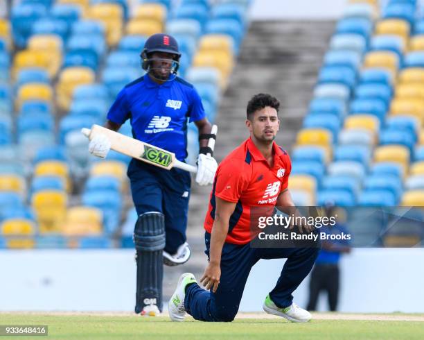 Daniel Bell-Drummond of South hits pass Brett D'Oliveira of North during the ECB North v South Series match One at Kensington Oval on March 18, 2018...