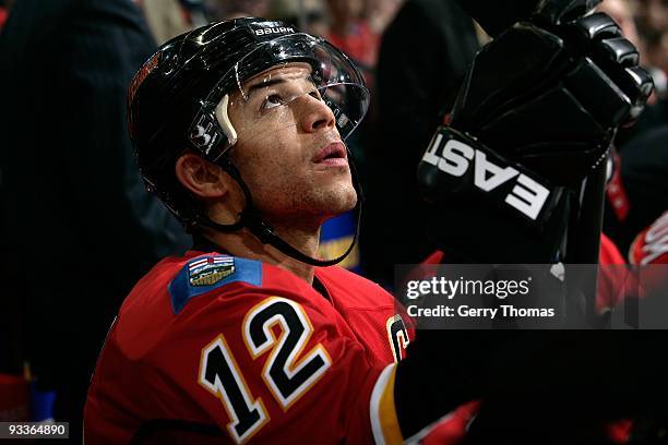 Jarome Iginla of the Calgary Flames watches the game from the bench in between shifts against the Colorado Avalanche on November 17, 2009 at...