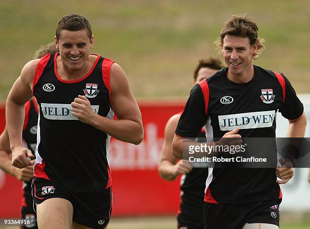 Michael Gardiner and Justin Koschitzke of the Saints run laps during a St Kilda Saints AFL training session held at Linen House Oval on November 25,...