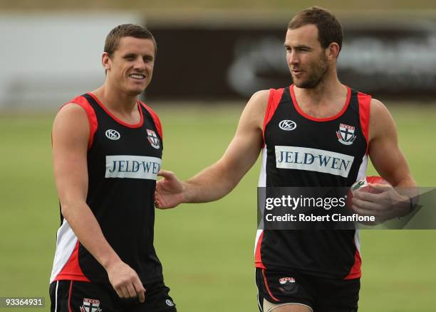 Michael Gardiner of the Saints talks with teammate Steven King during a St Kilda Saints AFL training session held at Linen House Oval on November 25,...