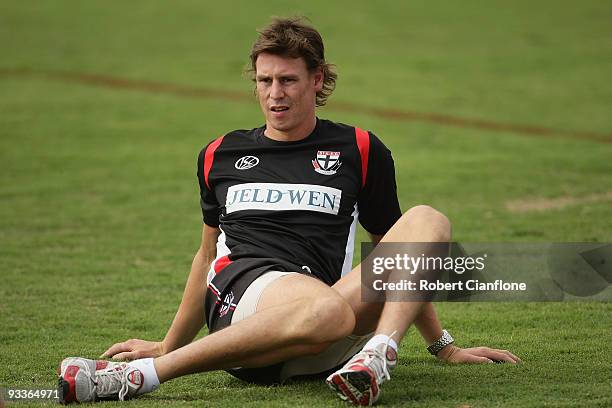 Justin Koschitzke of the Saints stretches during a St Kilda Saints AFL training session held at Linen House Oval on November 25, 2009 in Melbourne,...