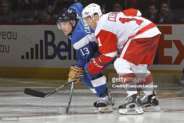 Mike Cammalleri of the Montreal Canadiens and Daniel Cleary of the Detroit Red Wings wait for a face off during the NHL game on November 21, 2009 at...