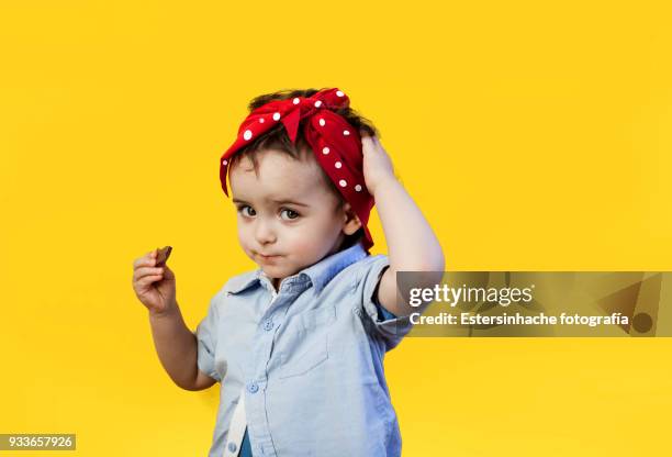 photograph of a girl with a red scarf on the head - igualdad de género fotografías e imágenes de stock