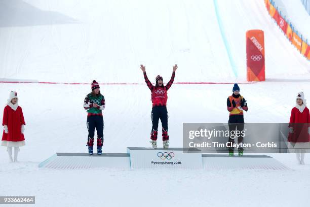 Silver medal winner Brittany Phelan, , of Canada, gold medal winner Kelsey Serwa of Canada salutes the crowd and bronze medal winner Fanny Smith, ,...