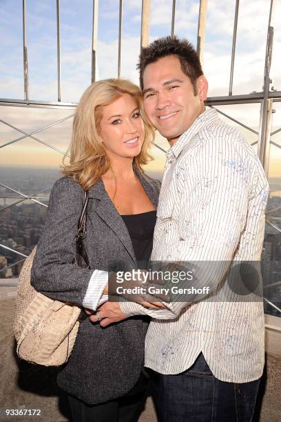 Michelle Mangan-Damon , and husband, New York Yankee Johnny Damon, pose for pictures on the Empire State Building Observation Deck in celebration of...