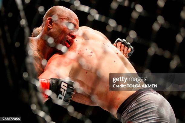 British fighter Jimi Manuwa grapples Poland's Jan Blachowicz in their Light Heavyweight fight during the UFC Fight Night at the O2 Arena in London on...