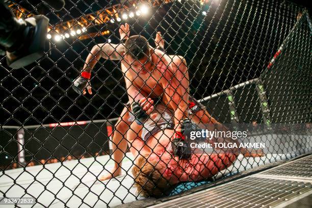 Russia's Alexander Volkov fights Brazil's Fabrico Werdum in their Heavyweight fight during the UFC Fight Night at the O2 Arena in London on March 17,...