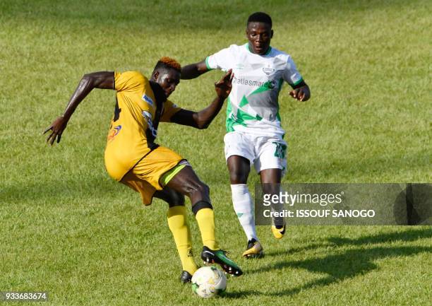 Ivory Coast's Mohamed Lamine Ndao vies with Zambia's Lazarous Lameck Banda during the Confederation of African Football Champions League match...