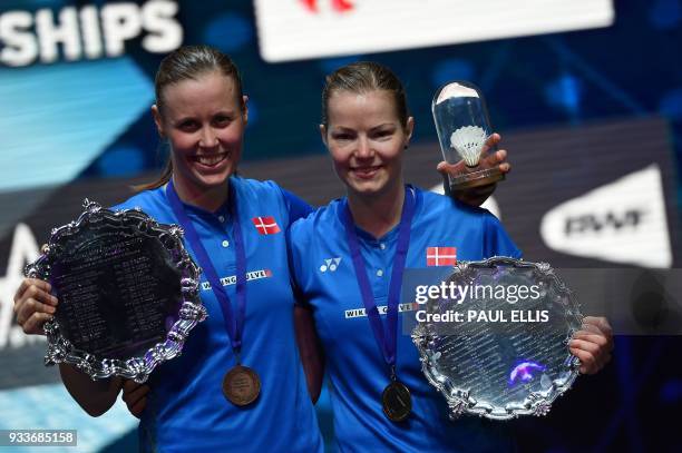 Denmark's Christinna Pedersen and Denmark's Kamilla Rytter Juhl pose with their winner's trophies after beating Japan's Yuki Fukushima and Japan's...