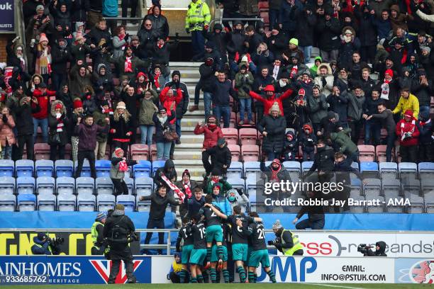 Fans of Wigan Athletic celebrates with Pieree-Emile Hojbjerg of Southampton as he scores a goal to make it 0-1 during The Emirates FA Cup Quarter...