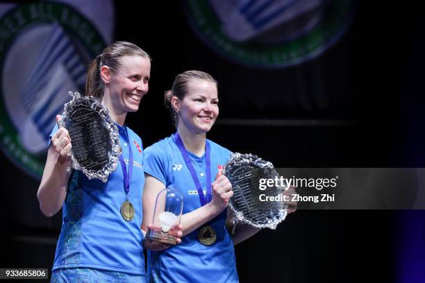 Kamilla Rytter Juhl of Denmark and Christinna Pedersen of Denmark celebrate with trophy after defeating Yuki Fukushima of Japan and Sayaka Hirota of...