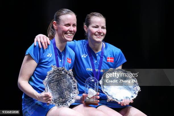 Kamilla Rytter Juhl of Denmark and Christinna Pedersen of Denmark celebrate with trophy after defeating Yuki Fukushima of Japan and Sayaka Hirota of...