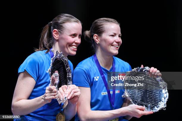 Kamilla Rytter Juhl of Denmark and Christinna Pedersen of Denmark celebrate with trophy after defeating Yuki Fukushima of Japan and Sayaka Hirota of...