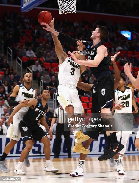 Nate Fowler of the Butler Bulldogs defends a shot by Carsen Edwards of the Purdue Boilermakers during the first half in the second round of the 2018...