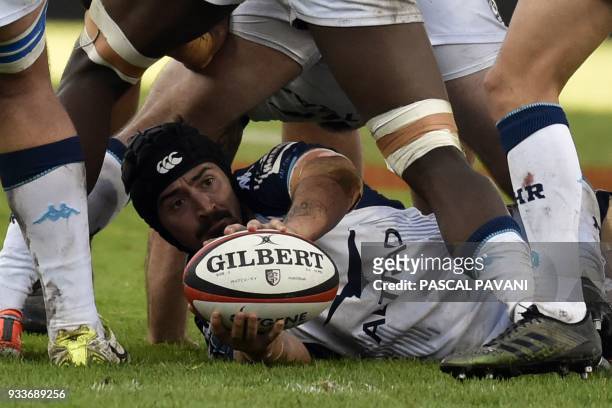 Montpellier's French number eight Alexandre Dumoulin holds the ball during the French Top 14 rugby union match between Toulouse and Montpellier, on...