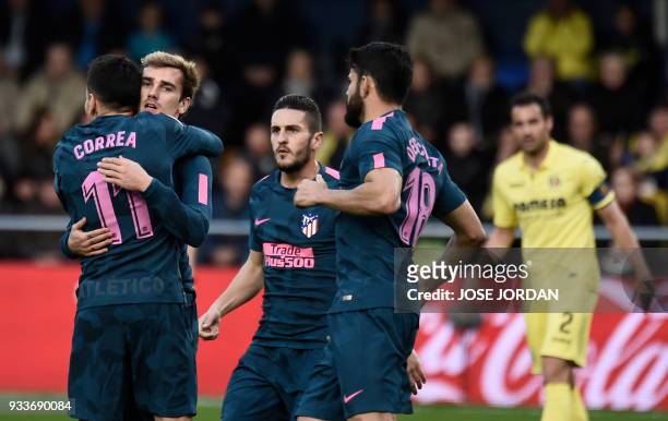 Atletico Madrid's French forward Antoine Griezmann celebrates a goal during the Spanish League football match between Villarreal CF and Club Atletico...