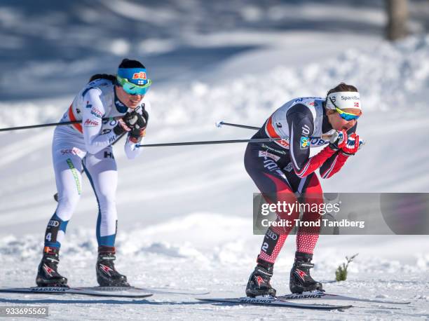 Ingvild Flugstad Oestberg of Norway, Krista Parmakoski of Finland during Ladies 10.0 km Pursuit Free at Lugnet Stadium on March 18, 2018 in Falun,...
