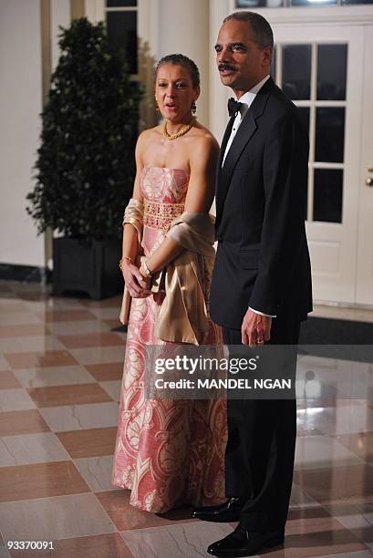 Attorney General Eric Holder and Sharon Malone arrive for the State dinner in honour of India�s Prime Minister Manmohan Singh November 24, 2009 at...