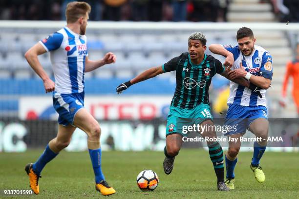 Harrison Read of Southampton and Sam Morsy of Wigan Athletic during The Emirates FA Cup Quarter Final match at DW Stadium on March 18, 2018 in Wigan,...