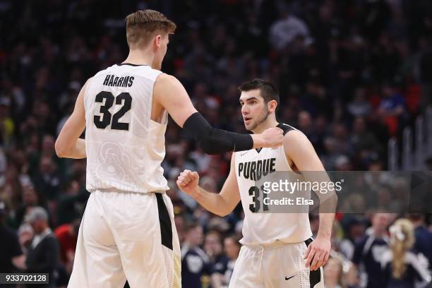 Matt Haarms of the Purdue Boilermakers celebrates with Dakota Mathias after defeating the Butler Bulldogs 76-73 in the second round of the 2018 NCAA...