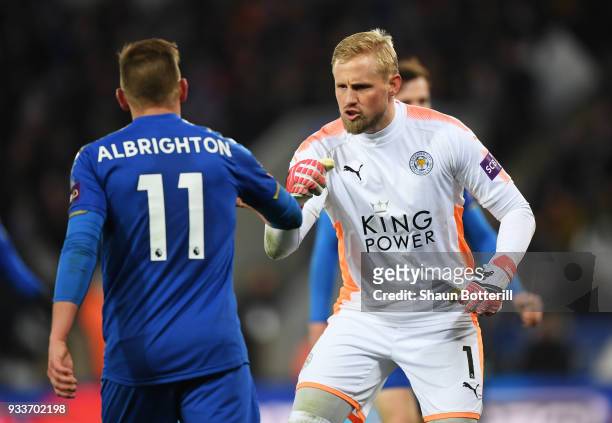 Kasper Schmeichel of Leicester City reacts with team mate Marc Albrighton during The Emirates FA Cup Quarter Final match between Leicester City and...