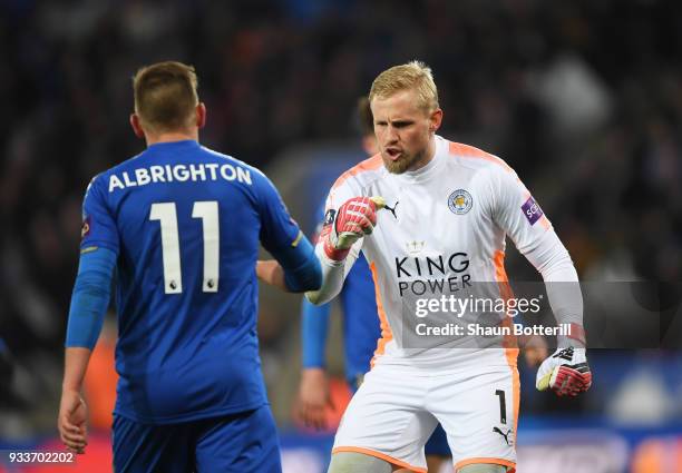 Kasper Schmeichel of Leicester City reacts with team mate Marc Albrighton during The Emirates FA Cup Quarter Final match between Leicester City and...