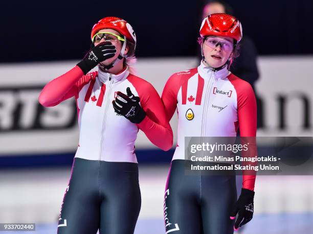 Marianne St-Gelais of Canada and Kim Boutin of Canada salute the fans in the second heat of the women's 1000 meter semifinal during the World Short...