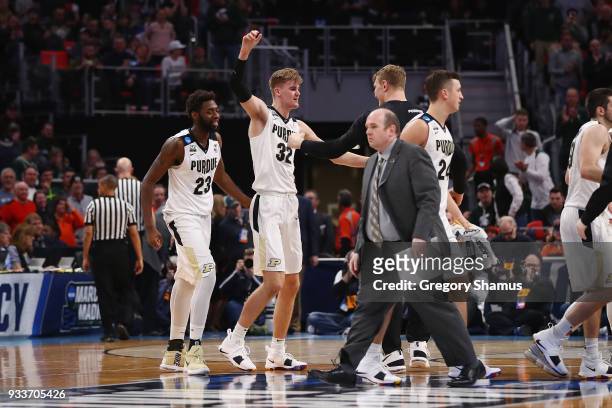 Matt Haarms of the Purdue Boilermakers celebrates with teammates after defeating the Butler Bulldogs 76-73 in the second round of the 2018 NCAA Men's...