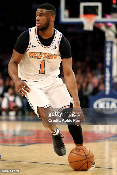 Emmanuel Mudiay of the New York Knicks dribbles towards the basket in the third quarter against the Dallas Mavericks during their game at Madison...