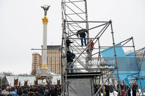 Protesters demolish decorative constructions during their rally for impeachment of President on the Independence Square in Kyiv, Ukraine, 18 March...