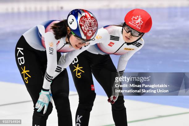 Min Jeong Choi of Korea comforts teammate Suk Hee Shim of Korea after finishing first in the women's 1000 meter Final during the World Short Track...