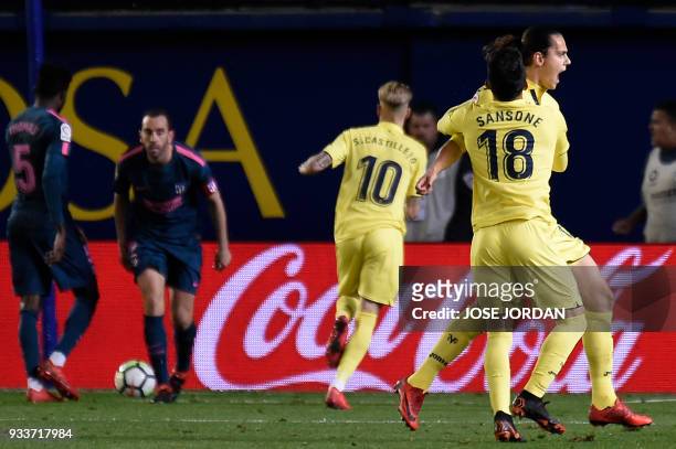 Villarreal's Turkish forward Enes Unal celebrates a goal with Villarreal's Italian forward Nicola Sansone during the Spanish League football match...